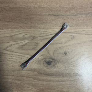 RGBW COB Clip on Corner. Used to connect two 12mm RGBW COB strips together to go round corners without soldering